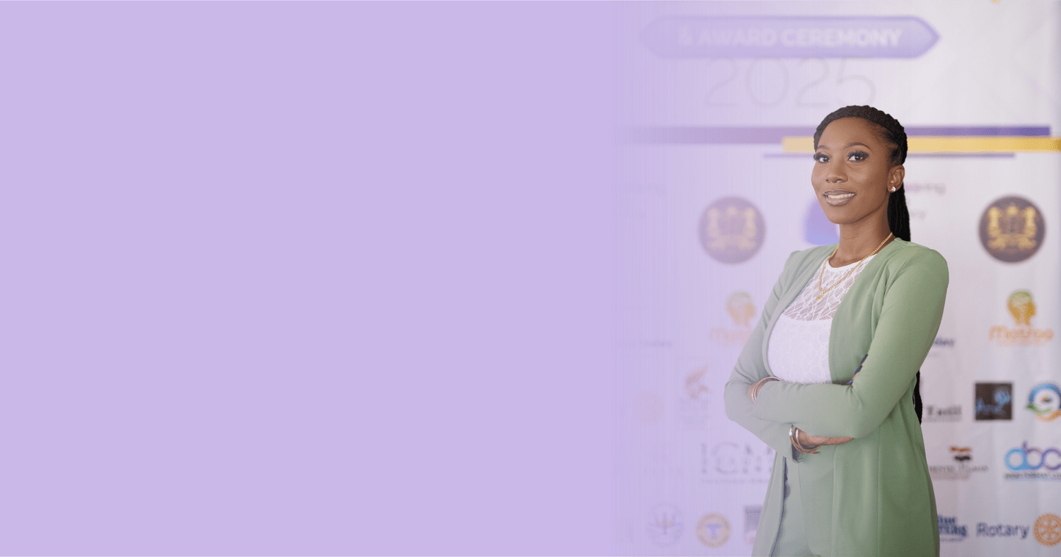 Portrait of Shontelle Brewster wearing a green suit